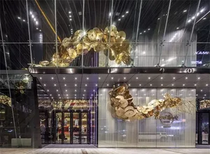 A modern entrance featuring metallic discs