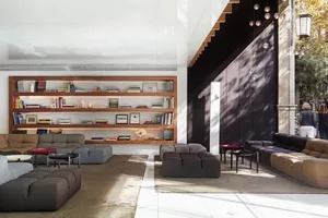 A spacious, modern living room with a mix of contemporary furniture and a large, open floor plan.