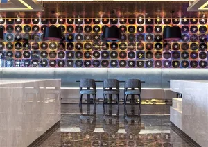 View of a modern restaurant interior featuring mixed materials like glass, metal, and wood.