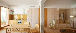 A minimalist residential kitchen with wooden features.