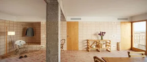 Modern living room with wooden furniture, terracotta floors, and patterned walls
