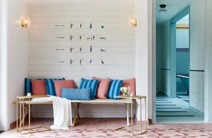 A well-designed spa relaxation room showcasing various seating options and relaxation areas.