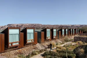 Residential buildings with metal exteriors in a mountainous landscape