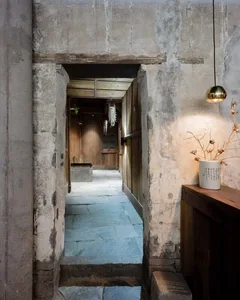 Industrial-style interior design featuring concrete materials and minimalist design elements.
