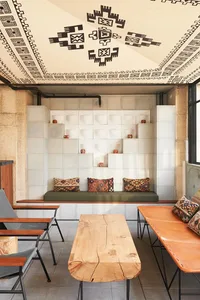 A modern industrial restaurant interior featuring concrete walls and minimalist design.