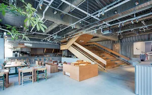 Industrial design restaurant with wooden counter and seating