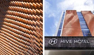 A modern brick hotel building with a unique design.