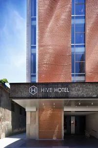 Entrance of a modern hotel with brick and glass elements