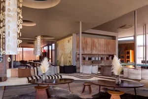 Modern lobby featuring wood and leather furniture