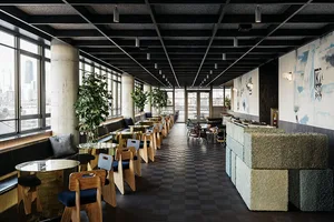 Interior view of a modern restaurant bar featuring concrete and steel elements.