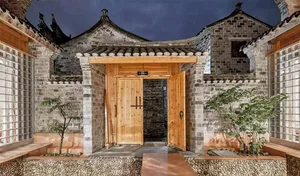 Traditional wooden and stone houses with brick details.