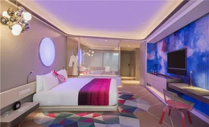 Luxurious bedroom with modern design elements and a mix of colors and materials.