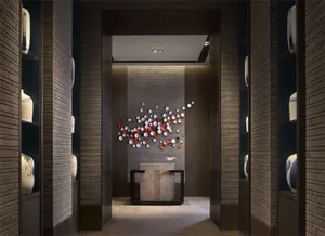 A modern lobby featuring stone walls and ceramic tiles