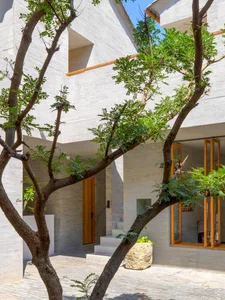 A minimalist architectural design featuring a concrete exterior.
