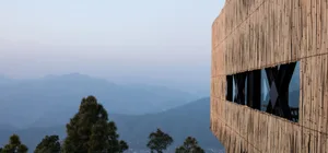 A modern building exterior made of bamboo with a unique architectural design.