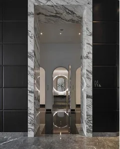 A modern interior space featuring marble materials and minimalist design elements.
