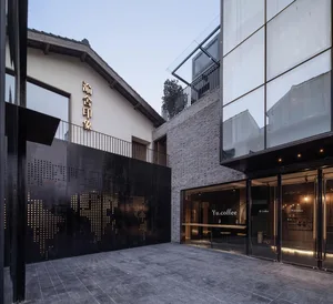 Modern coffee shop exterior with concrete, glass, and wood materials