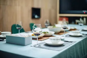 Modern dining room with glass and ceramic elements.