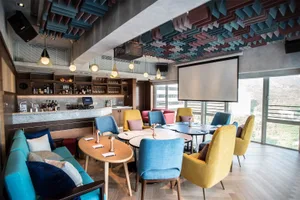 Modern café featuring concrete, brick, and wood materials