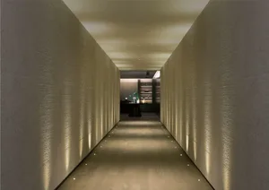 A minimalist corridor with textured walls, soft lighting, and a modern aesthetic.