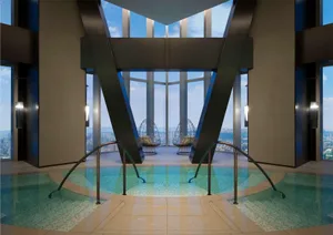 An indoor pool area with glass and marble features, designed for relaxation and luxury in a hotel suite.