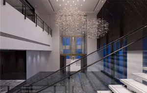 A modern lobby featuring a glass chandelier.