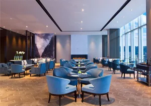 Modern restaurant interior design with fabric seats and tables.