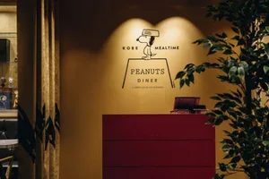 A wooden counter with signage that reads 'Peanuts Diner'.