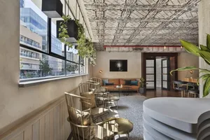 Modern industrial-style restaurant interior with metal furniture and decor.