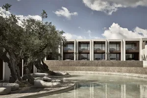 A modern residential exterior with concrete, glass, and wood materials.