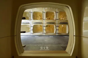 An image of a modern, compact living space with integrated sleeping pods.