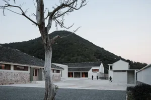 A modern residential building made of stone and cement.
