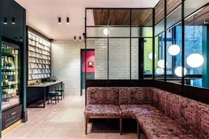 A design image of a modern restaurant featuring tiled flooring and white brick walls.