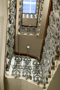 A detailed view of an ornate, metallic staircase with intricate designs.