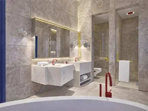 Modern bathroom interior with marble tiles and glass surfaces