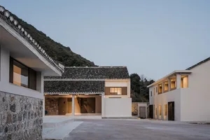 A modern residential exterior made of concrete, featuring clean lines and a minimalist design.