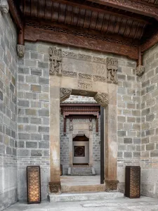 Stone and wooden entrance of a historical building.