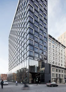Modern office building constructed with glass and cement materials.