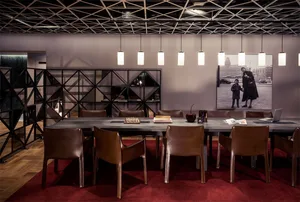 A modern office space with a concrete floor and minimalist design.