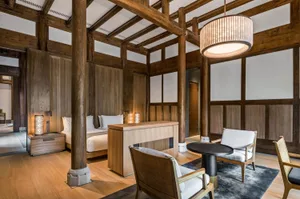 Modern residential room with wooden furniture and flooring.