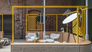 Modern industrial cafe featuring a metal frame and concrete seating base.