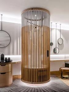 A modern wooden closet with a white cylindrical structure inside, featuring minimalist design elements and sleek lines.