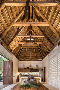 Industrial-style kitchen with wooden ceiling and open-concept design.