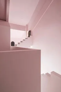 Minimalist architectural space featuring a pink staircase rendered in detail.