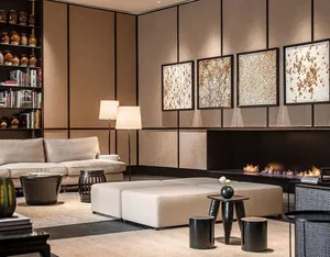 Luxurious modern living room with beige upholstered furniture, natural fiber rug, and sleek fireplace.