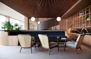 An image of a modern office space featuring wooden paneled walls.