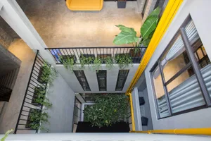 Industrial-style interior space with concrete walls and exposed pipes