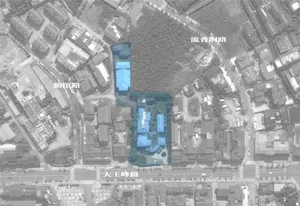 Aerial view of a city's urban planning area with highlighted buildings and roads.