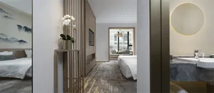 A modern hotel suite featuring white wood, marble, and fabric.