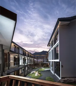 Modern residential building with concrete terraces and Masonry facade.